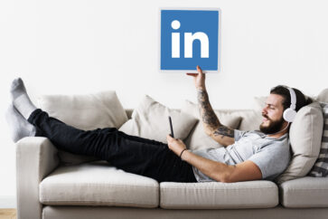 person-holding-linkedin-icon